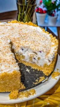 Delicious Pina Colada Pie topped with coconut and pineapple slices