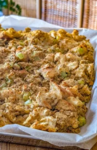 A delicious bowl of ultimate Thanksgiving stuffing with herbs and spices.