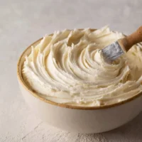 Delicious buttercream frosting swirled on a cake