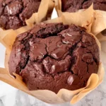 Delicious freshly baked chocolate chunk muffins with melting chocolate pieces