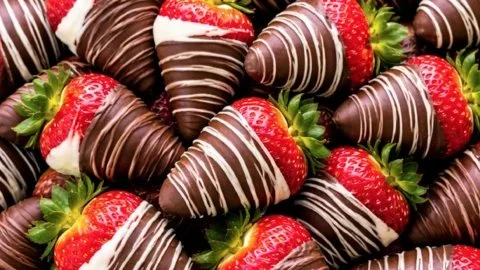 Delicious chocolate covered strawberries arranged on a plate