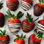 Deliciously dipped chocolate covered strawberries on a white plate