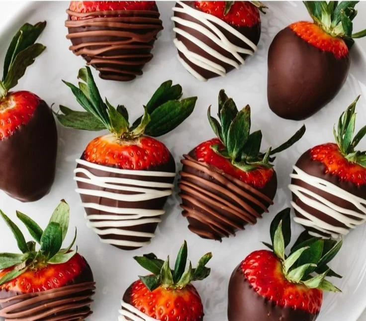 Deliciously dipped chocolate covered strawberries on a white plate