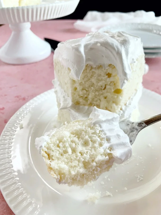 Deliciously moist favorite white cake with icing and decorative toppings