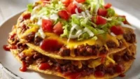 Homemade Taco Bell Mexican pizza topped with fresh ingredients and cheese