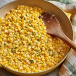 Honey Butter Skillet Corn served in a cast-iron skillet