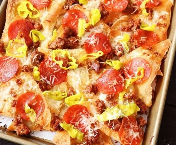Old Chicago’s Italian Nachos served with fresh toppings and flavorful sauces.
