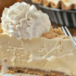 Delicious Root Beer Float Pie topped with whipped cream and root beer syrup.