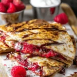 Sweet raspberry chocolate chip quesadilla on a plate