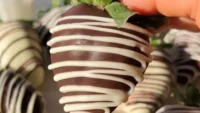 Vegan chocolate-covered strawberries drizzled with dark chocolate