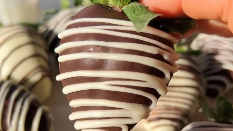 Vegan chocolate-covered strawberries drizzled with dark chocolate