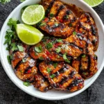 Bold chili-lime marinade in a bowl with fresh ingredients around it.