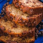 Delicious homemade banana bread with chocolate chips on a wooden table
