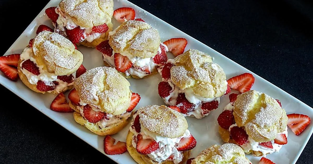 Delicious creamy strawberry profiteroles topped with fresh strawberries