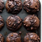 Decadent double-chocolate chip muffins fresh out of the oven
