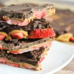 Delicious Strawberry-Chocolate Bark topped with red strawberries and drizzled chocolate