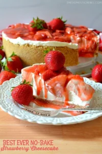 Unbaked strawberry cheesecake topped with fresh strawberries